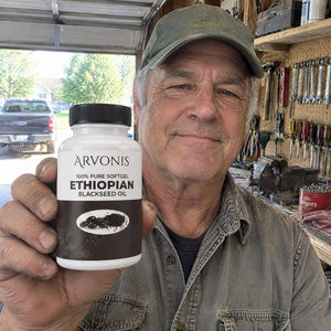 Arvonis customer holding Arvonis Ethiopian Blackseed Oil